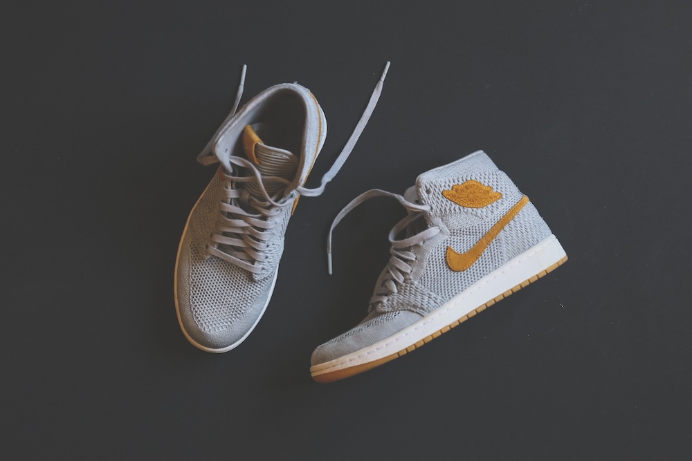 pair of white shoes on a gray background